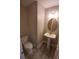 Elegant powder room with pedestal sink, and wood-look tile flooring at 3805 Conough Ln, Las Vegas, NV 89129