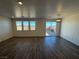 Bright and airy living room with hardwood floors and sliding glass doors at 9356 Newbattle St, Las Vegas, NV 89178