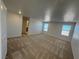 Large main bedroom with plush carpeting and access to en-suite bathroom at 9356 Newbattle St, Las Vegas, NV 89178