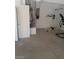 Garage with water heater, vacuum, and exercise equipment at 9758 Camino Capistrano Ln, Las Vegas, NV 89147