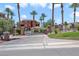 Gated entrance to community with palm trees and stonework at 85 Luce Del Sole # 3, Henderson, NV 89011