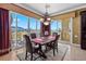 Dining area with sliding doors leading to a balcony and mountain views at 85 Luce Del Sole # 3, Henderson, NV 89011