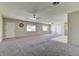 Large carpeted living room with brick wall and window at 1711 E State Highway 168, Moapa, NV 89025