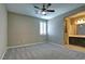 Spacious bedroom with ceiling fan and ensuite bathroom access at 1140 Apollo Gardens St, Henderson, NV 89052