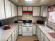 Bright kitchen features white cabinets and appliances at 4664 W Twain Ave, Las Vegas, NV 89103