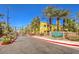 Rain Tree Villas entrance with gated access and landscaping at 7950 W Flamingo Rd # 1086, Las Vegas, NV 89147