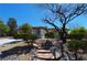 Landscaped yard with stone pathway leading to charming home at 2881 Thunder Bay Ave, Henderson, NV 89052