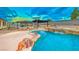 Inviting pool with waterfall feature, surrounded by a spacious patio at 915 Calville Estates Ct, Henderson, NV 89015