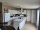 Bright kitchen featuring white cabinets and an island at 41 W Zapata Dr, Pahrump, NV 89048