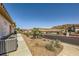 Landscaped backyard with desert plants and AC units at 250 Big Horn Dr, Boulder City, NV 89005