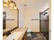 Clean bathroom with granite vanity and a glass-enclosed shower at 250 Big Horn Dr, Boulder City, NV 89005