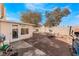 Brick paved backyard with patio furniture and fire pit at 2903 Galena Peak Ln, Las Vegas, NV 89156