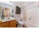 Clean bathroom with tub and wood vanity at 2903 Galena Peak Ln, Las Vegas, NV 89156