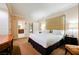 Spacious bedroom with king-size bed, large headboard and ensuite bathroom at 125 E Harmon Ave # 414, Las Vegas, NV 89109