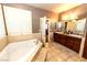 Bathroom with a large soaking tub and double vanity at 2257 Candlestick Ave, Las Vegas, NV 89052