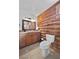 Bathroom with log cabin styling, granite vanity, and tiled floor at 4785 Knotty Pine Way, Mount Charleston, NV 89124