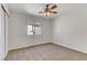 Spacious bedroom with ceiling fan and double closets at 10401 Daisy Dawn Ct, Las Vegas, NV 89129