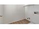 Bright laundry room with vinyl flooring and built-in shelving at 10401 Daisy Dawn Ct, Las Vegas, NV 89129