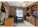 Home office with built-in shelving and wood desk at 390 E Delamar Dr, Henderson, NV 89015