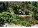 Lush landscaping surrounds a serene pond, creating a tranquil outdoor setting at 1382 N Trout Canyon Rd, Las Vegas, NV 89124