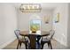 Dining area with round table and window view at 3784 Pama Ln, Las Vegas, NV 89120