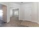 Bright entryway with tile flooring, leading to a carpeted room and bathroom at 8888 Catfish Stream Ave, Las Vegas, NV 89178