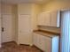 Kitchen with white cabinets and a built in pantry at 8888 Catfish Stream Ave, Las Vegas, NV 89178