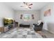 Living room with gray recliner, ottoman, and TV at 1640 S Outlaw St, Pahrump, NV 89060