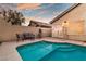 Backyard pool, spa, and patio furniture create a relaxing retreat at 211 Sandpiper Village Way, Henderson, NV 89012