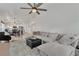 Living room with sectional sofa, fireplace and view into kitchen at 211 Sandpiper Village Way, Henderson, NV 89012