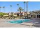 Inviting community swimming pool with surrounding lounge chairs and landscaping at 5185 Indian River Dr # 225, Las Vegas, NV 89103