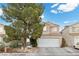 Two-story house with attached garage and mature tree at 2208 Saint Paul Way, Las Vegas, NV 89104