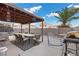 Covered patio, with seating area, grill, and trampoline at 2208 Saint Paul Way, Las Vegas, NV 89104