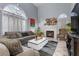 Living Room with fireplace and large windows at 2208 Saint Paul Way, Las Vegas, NV 89104