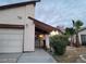 House exterior with a white garage door and landscaping at 4766 S Mojave Rd, Las Vegas, NV 89121