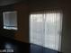 Dining room with dark flooring, sliding glass doors, and window with blinds at 1432 Evening Song Ave, Henderson, NV 89012