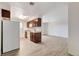 Kitchen with dark wood cabinets, white appliances, and granite countertops at 2451 N Rainbow Blvd # 1014, Las Vegas, NV 89108