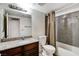 Well-lit bathroom with granite countertop, toilet, and shower/tub at 2451 N Rainbow Blvd # 1014, Las Vegas, NV 89108