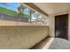 Private patio with storage closet and view of trees and building at 2451 N Rainbow Blvd # 1014, Las Vegas, NV 89108