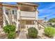 Two-story building with Spanish-style architecture and landscaping at 925 Boulder Mesa Dr # 101, Las Vegas, NV 89128