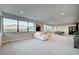 Game room with seating, game table and natural light at 1458 Dragon Stone Pl, Henderson, NV 89012