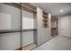 Custom-designed walk-in closet with extensive shelving and hanging rods at 1458 Dragon Stone Pl, Henderson, NV 89012