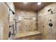 Large walk-in shower with multiple shower heads and bench at 14 Corral De Tierra Pl, Henderson, NV 89052