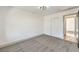 Simple bedroom with carpet flooring and sliding doors to closet at 8509 Copper Falls Ave, Las Vegas, NV 89129