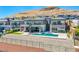 Aerial view of a luxury home with a pool and mountain backdrop at 11166 Villa Bellagio Dr, Las Vegas, NV 89141