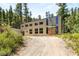 Modern two-story home with large windows and a metal exterior at 0 Apn 128-07-201-016 N Fork Deer Creek, Mount Charleston, NV 89124