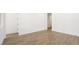 Empty bedroom with light brown laminate flooring at 34 Barrio Alto Ct, Henderson, NV 89011