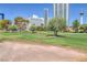 View of a lush green golf course with city skyline in the background at 639 Oakmont Ave # 3908, Las Vegas, NV 89109