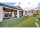 Artificial turf backyard with covered patio and mountain views at 26 Sun Mirage Ave, Henderson, NV 89011