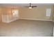 Large loft area with carpet and ceiling fan at 92 Laying Up Ct, Las Vegas, NV 89148